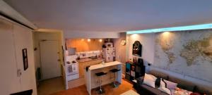 a kitchen with a map of the world on the wall at Medium size room for 2 in Toronto