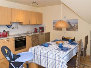 Η κουζίνα ή μικρή κουζίνα στο Ferienwohnung Meeresblick Norddeich mit Balkon
