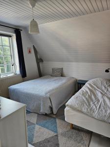 Ένα ή περισσότερα κρεβάτια σε δωμάτιο στο Central Nørresundby Gem - Steps from Aalborg