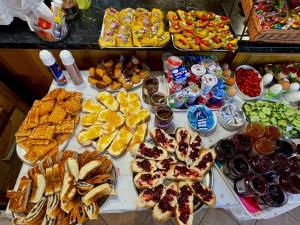 a table with many different types of food on it at Alva Pension 1 in Mikulov