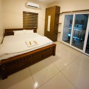 Postel nebo postele na pokoji v ubytování The Racors Residence