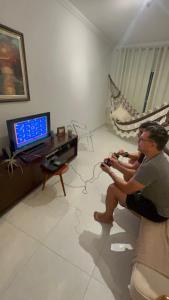 Μια τηλεόραση ή/και κέντρο ψυχαγωγίας στο Apartamento Aconchegante com Varanda em Pesqueira +5 φωτογραφίες