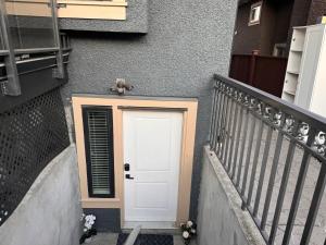 a teddy bear sitting on top of a door at Cozy 1 Bedroom Suite in Vancouver