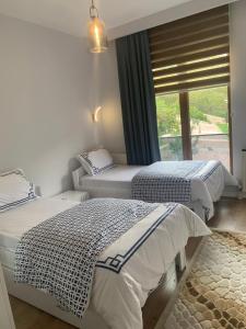 Ένα ή περισσότερα κρεβάτια σε δωμάτιο στο Villa saklı bahçe