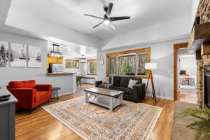 a living room with a couch and a table at Ski Haus- Remodeled- Near Tamarack and Lake Cascade- pet ok in Donnelly
