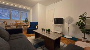 a living room with a couch and a table at Apartman Mik - Daruvar in Daruvar