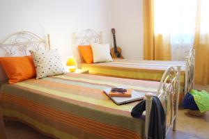 Posteľ alebo postele v izbe v ubytovaní Casa Vacanza da Rosa