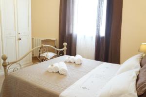 Posteľ alebo postele v izbe v ubytovaní Casa Vacanza da Rosa