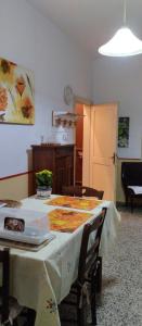 a room with a table with a table cloth on it at Ii Forno in Cossogno