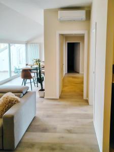 a living room with a couch and a table at Bellavista Deluxe in Cesena +23 photos