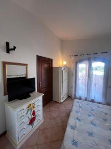 TV a/nebo společenská místnost v ubytování Villa Turisarda