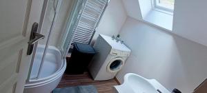 a small bathroom with a toilet and a sink at La Clair'fontaine in Clairvaux +21 photos