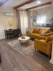 a living room with a couch and a table at Skimbo's Apartment in Lusaka