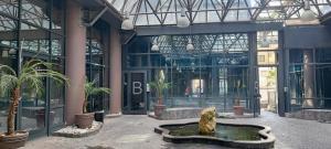 a large building with a fountain in front of it at B&B PalmaViola in Caserta