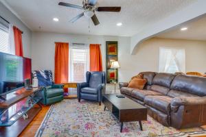 a living room with a brown leather couch and chairs at Extended Stay Home 3 Mi to Dtwn Pueblo in Pueblo