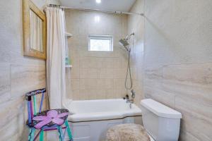a bathroom with a white toilet and a shower at Extended Stay Home 3 Mi to Dtwn Pueblo in Pueblo +17 photos