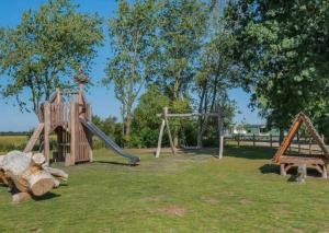 a playground with two swings and a slide at Herons mead 12 in Addlethorpe