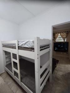 Ένα ή περισσότερα κρεβάτια σε δωμάτιο στο Prainha 706