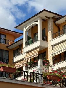 an apartment building with balconies and flowerpots at Boulevard Sea Residenz 250 meter zum Sandstrand in Sunny Beach