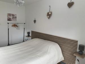 Ένα ή περισσότερα κρεβάτια σε δωμάτιο στο Appartement de la Chapelle
