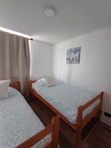 Ένα ή περισσότερα κρεβάτια σε δωμάτιο στο Departamento Condominio Serena Pacifico +8 φωτογραφίες