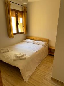 Ένα ή περισσότερα κρεβάτια σε δωμάτιο στο Apartamento Torres +15 φωτογραφίες