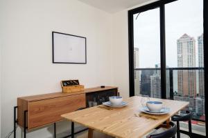 a dining room with a table and a large window at 1BR Amazing sea view in Calle 50 in Panama City +14 photos