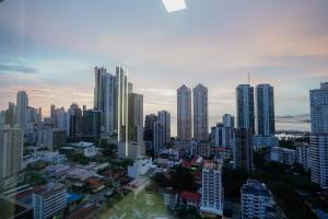 a view of a city with tall buildings at 1BR Amazing sea view in Calle 50 in Panama City