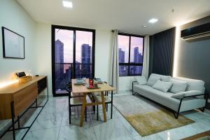 a living room with a couch and a table at 1BR Amazing sea view in Calle 50 in Panama City