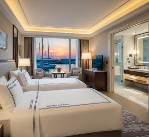Ένα ή περισσότερα κρεβάτια σε δωμάτιο στο Sunset Marina Hotel +40 φωτογραφίες