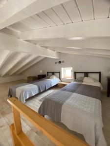 a bedroom with two beds in a attic at Sunny Aljezur da Viana, (Aljezur, Costa Vicentina) in Aljezur +35 photos