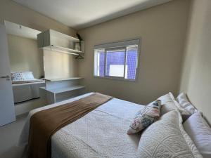 Ένα ή περισσότερα κρεβάτια σε δωμάτιο στο Conforto e aconchego pertinho do mar de Palmas +10 φωτογραφίες