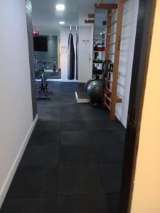 a room with a gym with a fitness ball on the floor at Comfort in the Best Area of COP 30 in Belém +4 photos