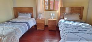 Кровать или кровати в номере Hotel Wayra Eco Lodge