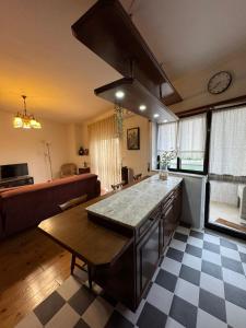 a kitchen with a large island in a room at Pequeno Refúgio in Braga