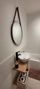 a bathroom with a sink and a mirror and a tub at Depto 3amb en Torreón del Monje in Mar del Plata +15 photos