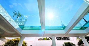 a view from the inside of a building with a window at STARLAND Luxury Pool Villa Pattaya Walking Street 8 Bedrooms in Pattaya South +23 photos