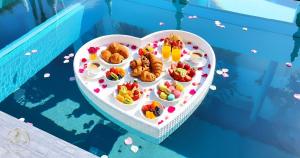 a plate of food in the shape of a heart at STARLAND Luxury Pool Villa Pattaya Walking Street 8 Bedrooms in Pattaya South