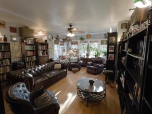 a living room with leather couches and a table at The Millennium Club at Solar Lodge, 2bdrm, 1 bath premium private apt in Chicago