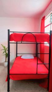 Ένα ή περισσότερα κρεβάτια σε δωμάτιο στο Hostal Abba