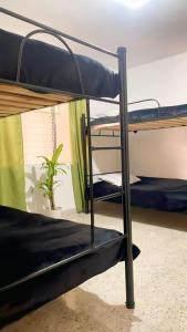 Ένα ή περισσότερα κρεβάτια σε δωμάτιο στο Hostal Abba