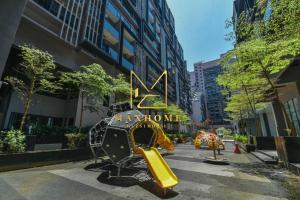 a playground in the middle of a city at Maxhome Suites at Imperio Melaka in Malacca
