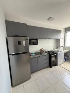 Kuchyň nebo kuchyňský kout v ubytování Apartamento vista para o rio ao lado do shopping