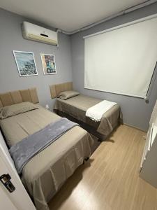 Postel nebo postele na pokoji v ubytování Apartamento vista para o rio ao lado do shopping + 35 fotografií