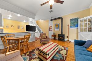 a living room with a blue couch and a table at Loyalist Lofts in Picton