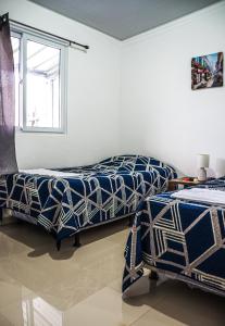 Giường trong phòng chung tại Casa del paseante