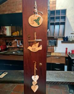 a wooden door with hearts on it in a kitchen at Casa Limoeiro 5min da ilha in Alter do Chao