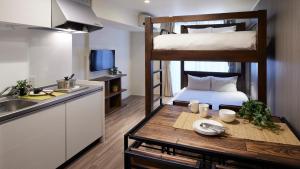 a kitchen and a room with two bunk beds at Minn Kamata in Tokyo +23 photos