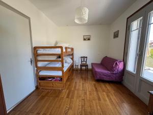 a room with a bunk bed and a couch at Maison rénovée, confort moderne, quartier calme, parking - FR-1-498-120 in Thonon-les-Bains