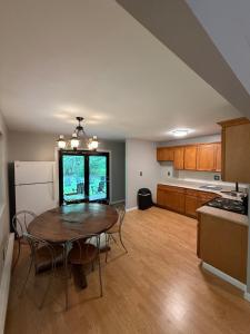 a kitchen with a table and a dining room at Luxury Mountain Villa - 3 bedroom, hot-tub, fire-pit in Hunter